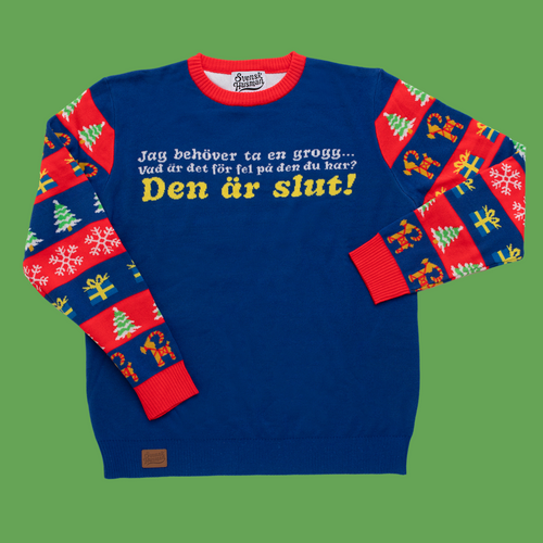 Blauer Damen-Weihnachtspullover mit dem Text Jag behöver ta en grogg und bunten Ärmelmotiven von Svenskhusman.