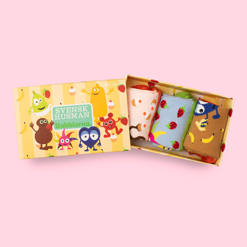 Yellow Babblarna gift box containing three pairs of colorful patterned kids