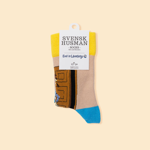Børnestrømper med Emil fra Lønneberg-motiv i gule, beige og blå farver fra Svenskhusman.