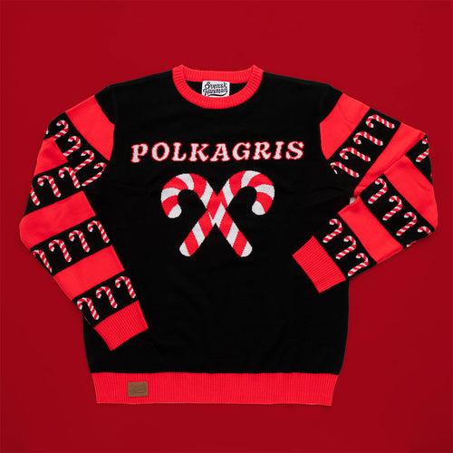 Gestrickter Weihnachtspullover in Rot und Schwarz mit Zuckerstangen und dem Text POLKAGRIS von Svenskhusman.