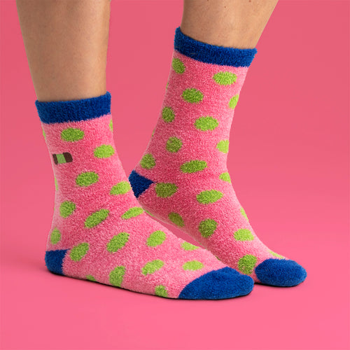 Fluffy pink socks with green dammsugare punsch roll pattern and blue details by Svenskhusman.