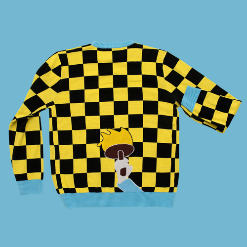 Yellow and black checkered Christmas sweater featuring a Santa