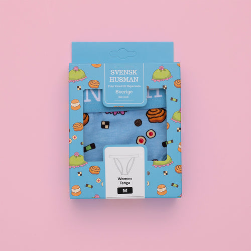 Baby blue thong panties with a Swedish fika pastry pattern in a blue gift box on a pink background.