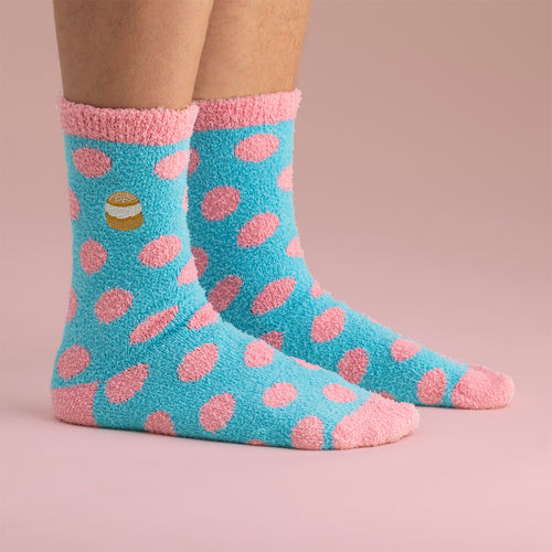 Blue and pink fluffy polka dot socks with a small embroidered semla motif from Svenskhusman.