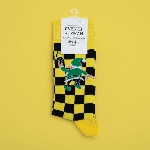 Yellow and black checkered socks featuring a green painter elf motif from Santa