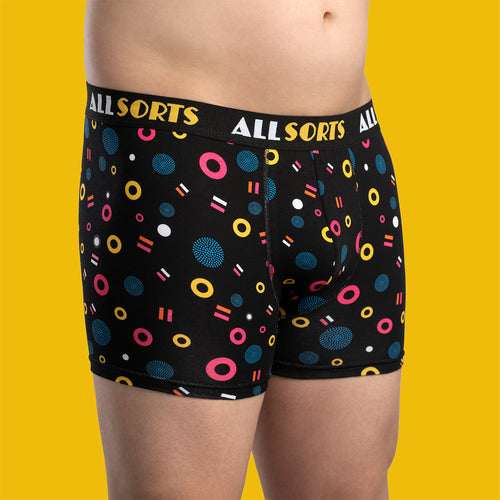 Black ALLSORTS boxer shorts with colorful licorice candy pattern on a male model by Svenskhusman.