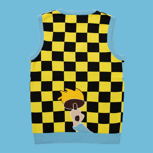 Yellow and black checkered knitted vest with a paintbrush graphic and light blue trim by Svenskhusman.