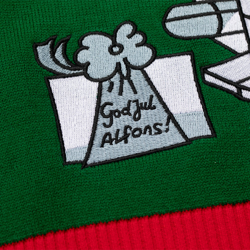 Green knitted Christmas sweater with an embroidered Alfons Åberg motif and text saying God Jul Alfons.