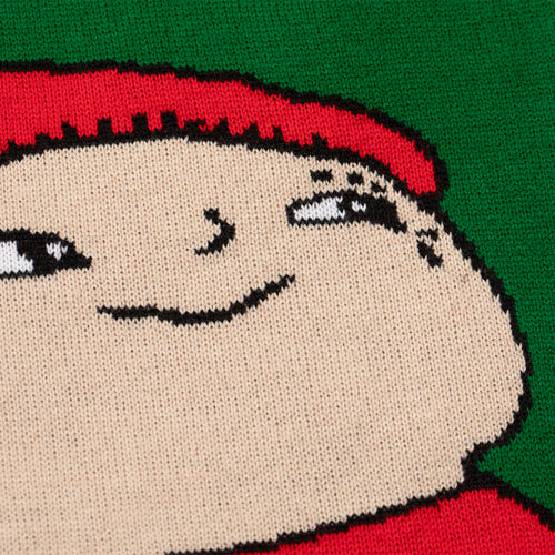 Close-up of the knitted Alfons Åberg design on a green Svenskhusman Christmas sweater.