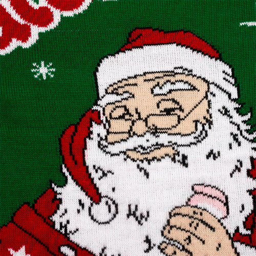 Close-up of a green knitted Christmas sweater with a Santa Claus and pink Juleskum candy motif.