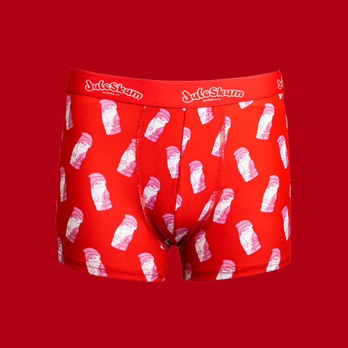 Röda boxerkalsonger med mönster av rosa Juleskum-tomtar på en röd bakgrund från Svenskhusman.