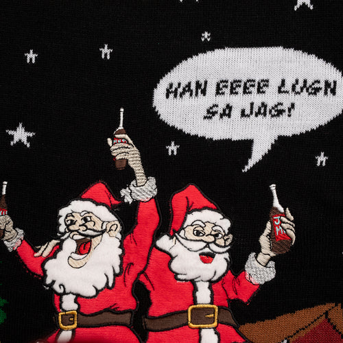 Black knitted Christmas sweater with Santas drinking julmust and the text 