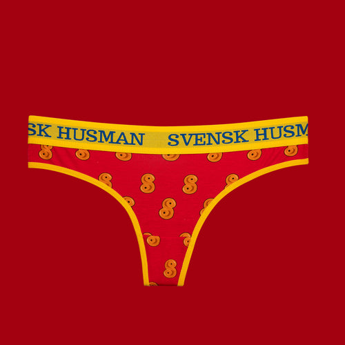 Röda stringtrosor med gult lussebullemönster och en logoprydd gul resår från Svenskhusman.